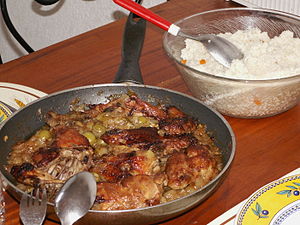 Yassa is a popular dish throughout West Africa prepared with chicken or fish. Chicken yassa is pictured.
