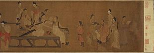 A long, horizontally oriented painting depicting fifteen people in a room. All but two of the people are adult men who are busy reading.