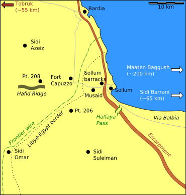 A large scale coloured map showing the Egyptian-Libyan border area near the coast; dotted lines identify the border and frontier barbed wire fence while black dots represent important places and towns.