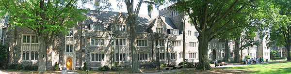Panoramic photo of a row of three-story Gothic style building exteriors