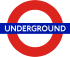 The word "UNDERGROUND" in white letters superimposed on a blue rectangle superimposed on the red circumference of a circle on a clear background