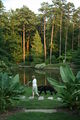 2008-07-15 Woman with dog on path at Duke Gardens.jpg