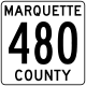 A white square road sign outlined in black containing the text MARQUETTE 480 COUNTY